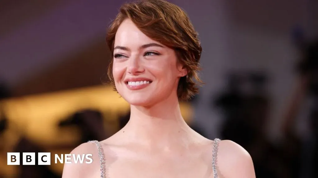 Emma Stone dazzles Venice with alien kidnap drama
