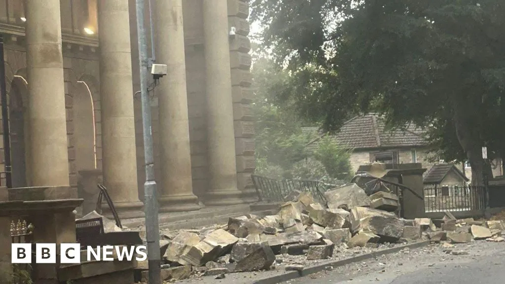 Part of Victorian building collapses into street