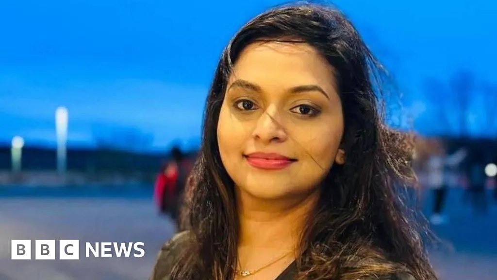 Body of 'cherished' woman found between parked cars