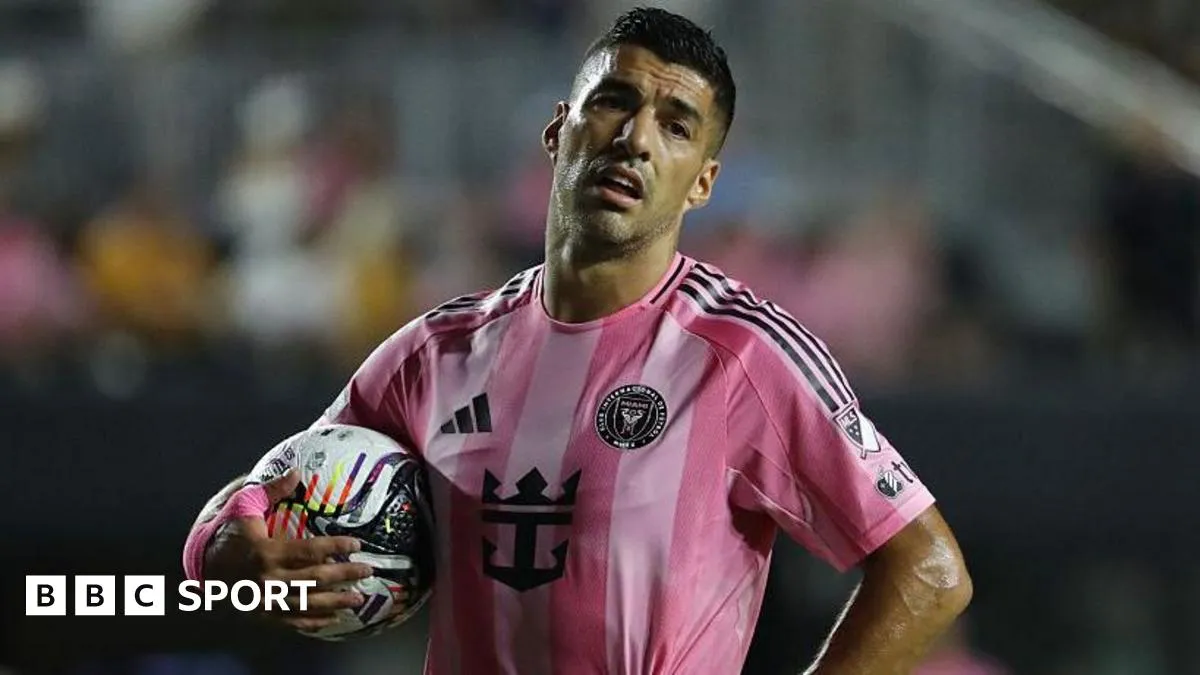 Suarez appears to spit at opposition coach after melee