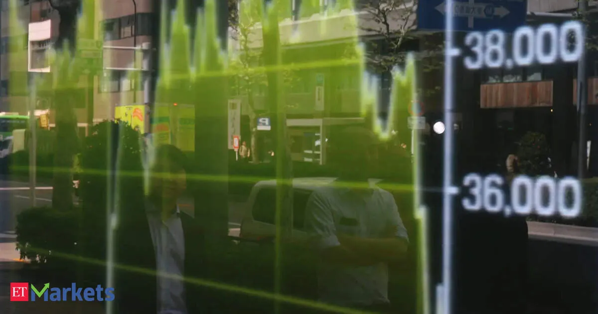 Japan's Nikkei hits record high, overheating caution limits gains