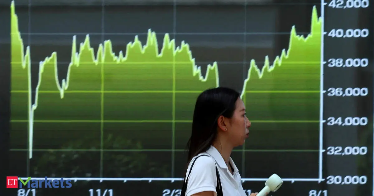 Japan's Nikkei ends at record high as chip-related shares gain on Wall Street boost