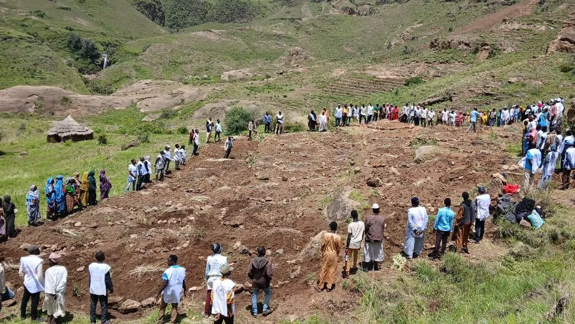 Villagers dig with hands to reach victims buried in Sudan landslide, group says